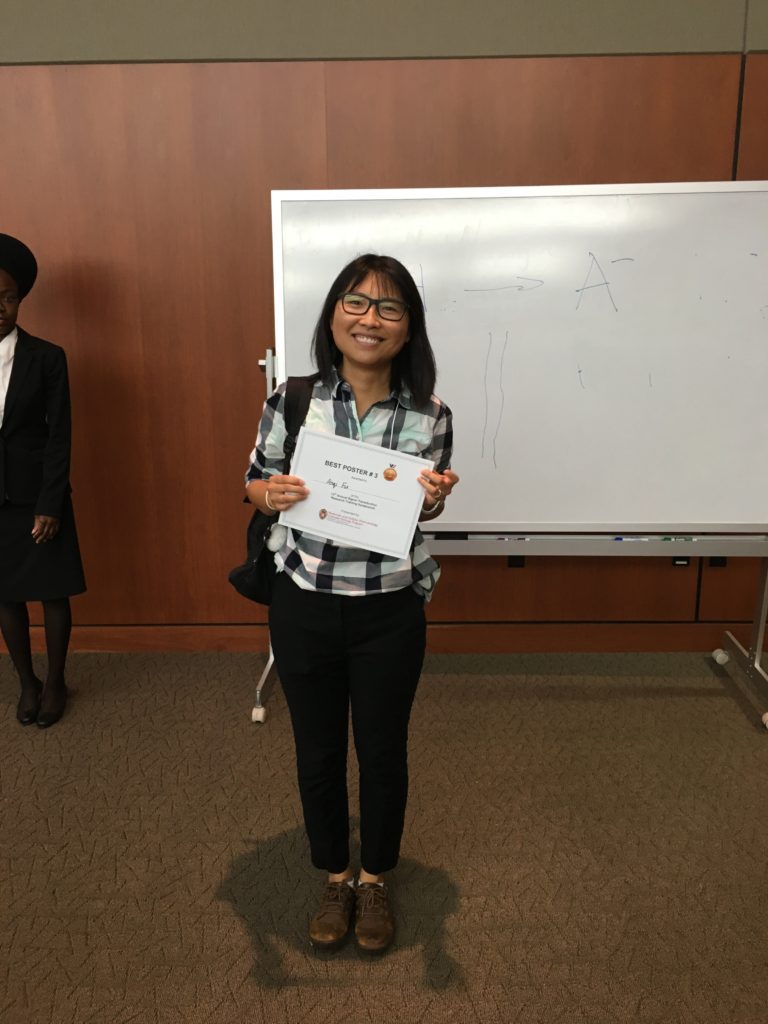 Student holding award